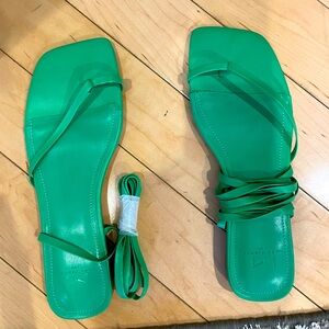 green sandals with straps that tie around your ankle